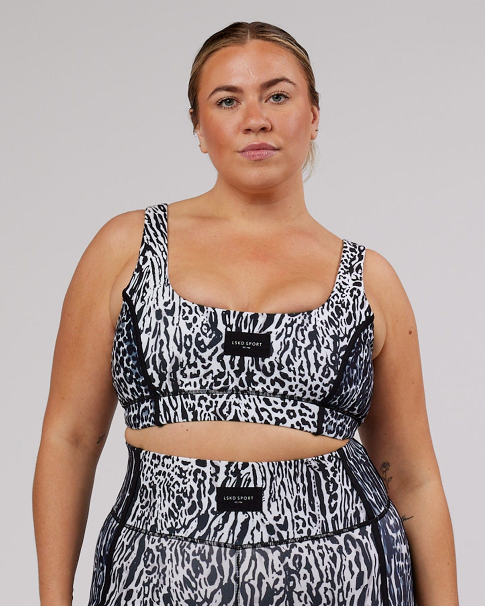 Model wearing Hunter Sports Bra - Snow Leopard