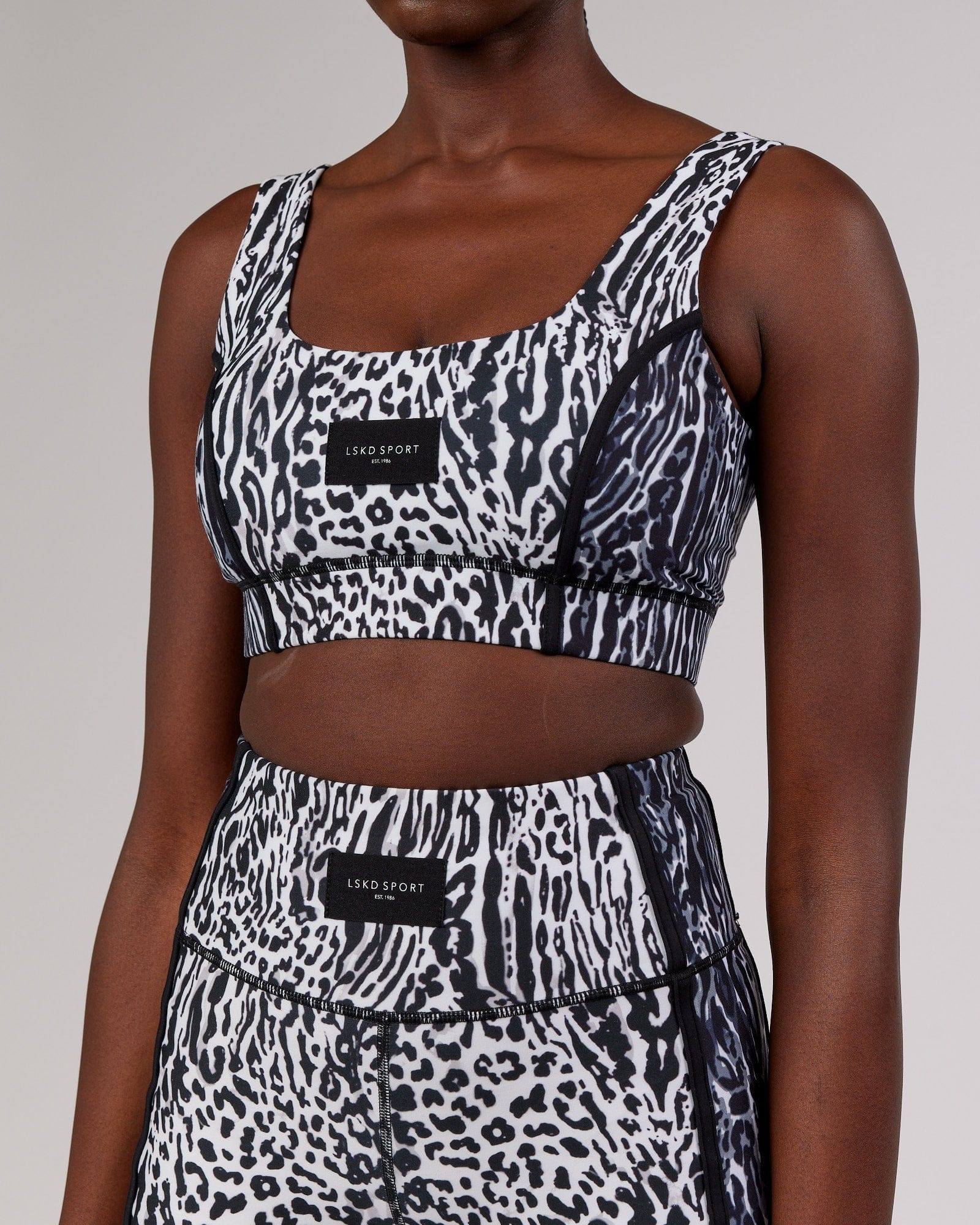 Model wearing Hunter Sports Bra - Snow Leopard