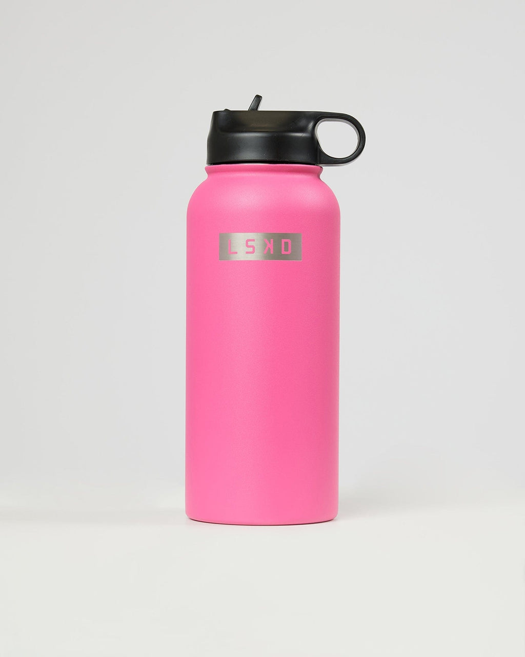 Model wearing Hydrosphere 32oz Insulated Metal Bottle - Flamingo