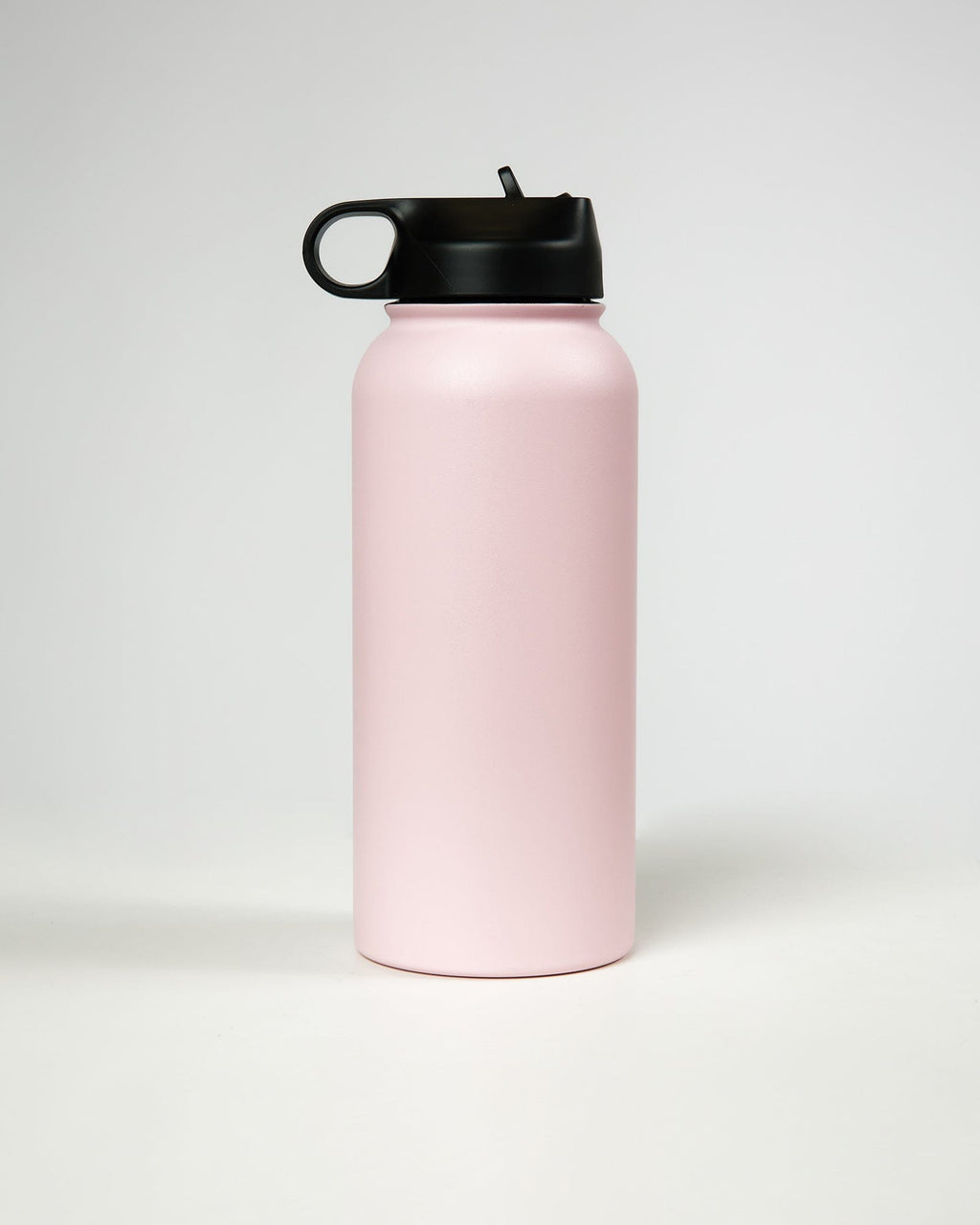 Model wearing Hydrosphere 32oz Insulated Metal Bottle - Pink