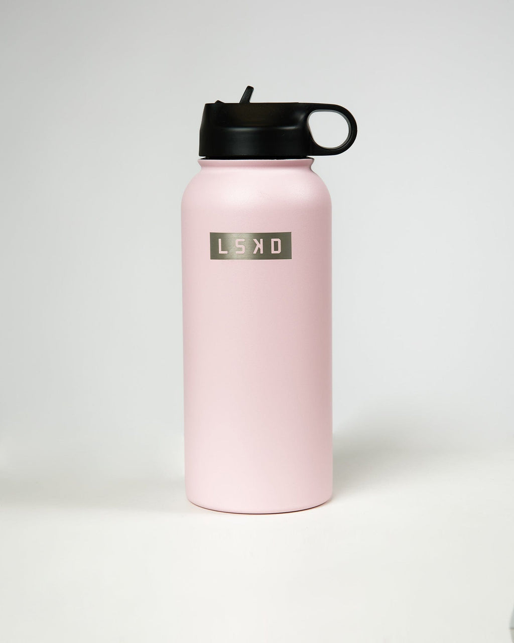 Model wearing Hydrosphere 32oz Insulated Metal Bottle - Pink