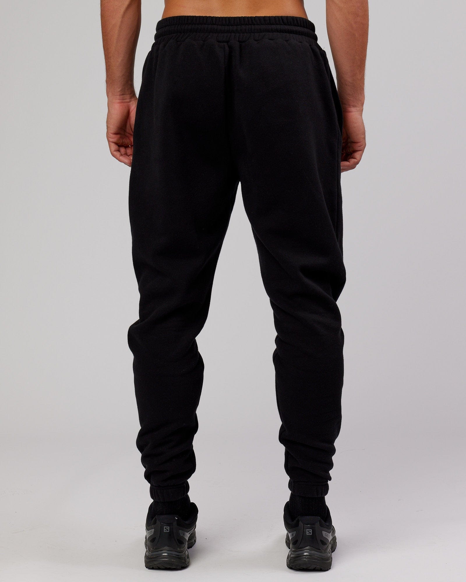 Model wearing Iconic Track Pant - Black