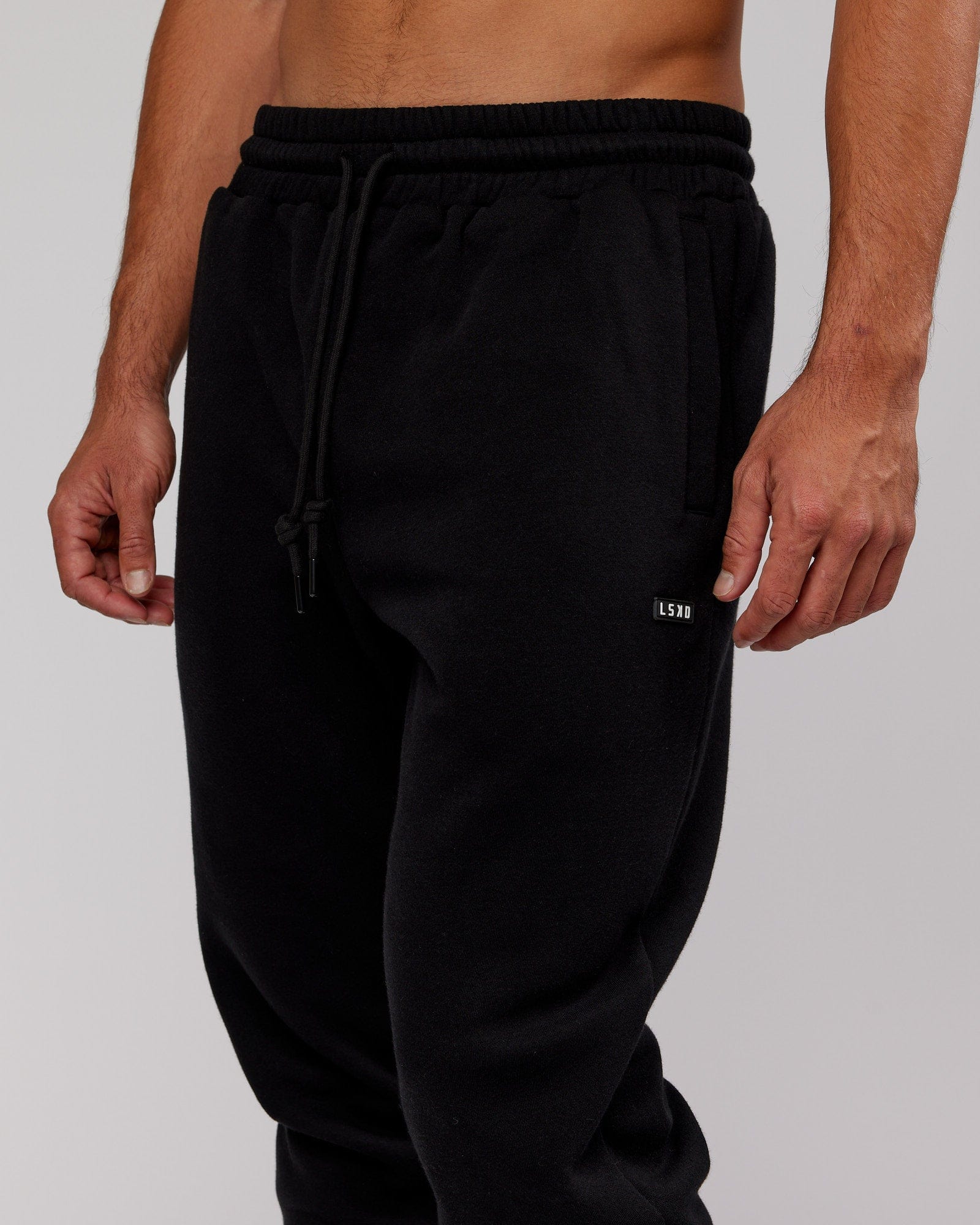 Model wearing Iconic Track Pant - Black