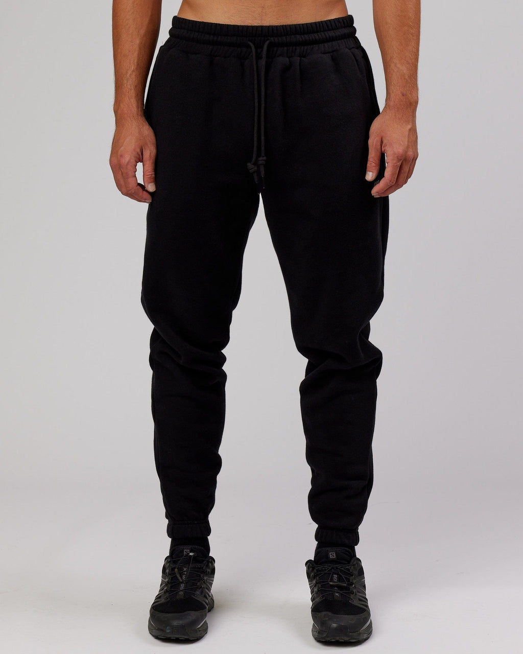 Model wearing Iconic Track Pant - Black