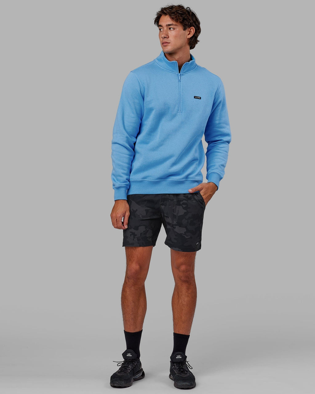 Model wearing Intensity 7" Performance Short - Black-Camo