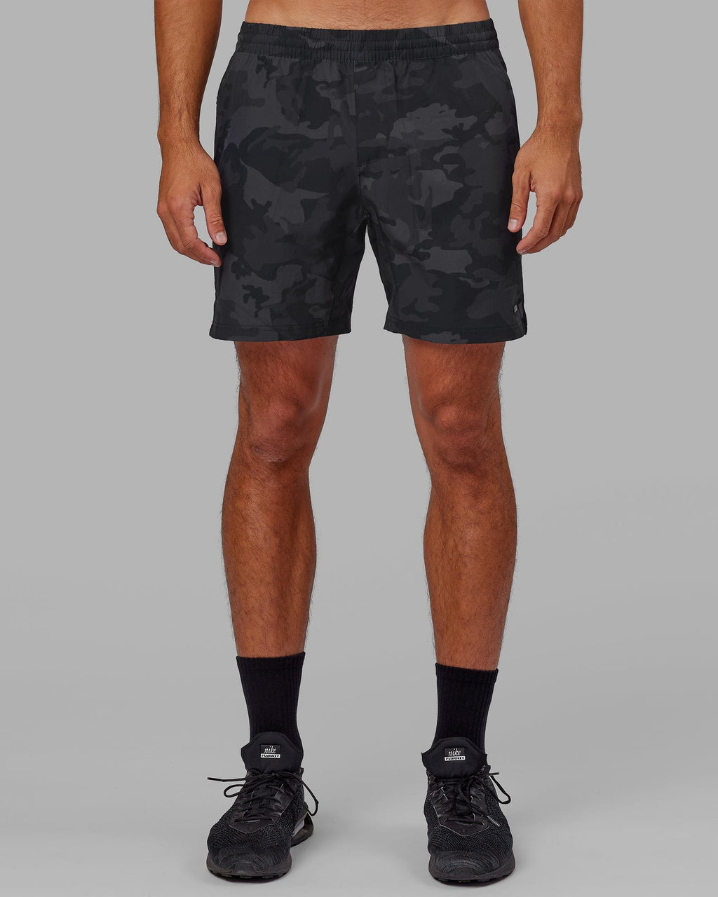 Model wearing Intensity 7" Performance Short - Black-Camo