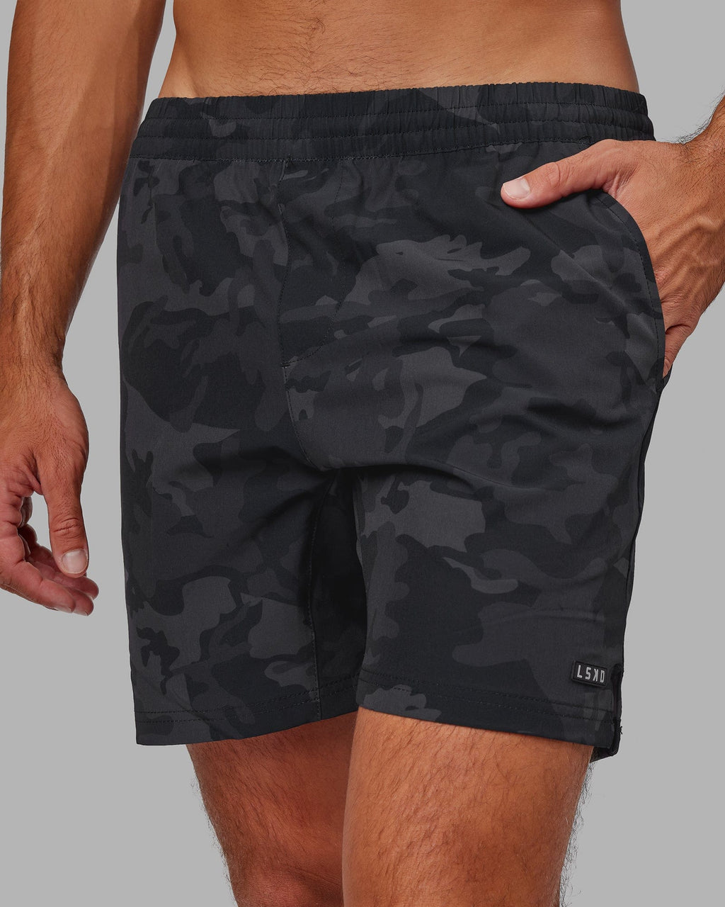 Model wearing Intensity 7" Performance Short - Black-Camo