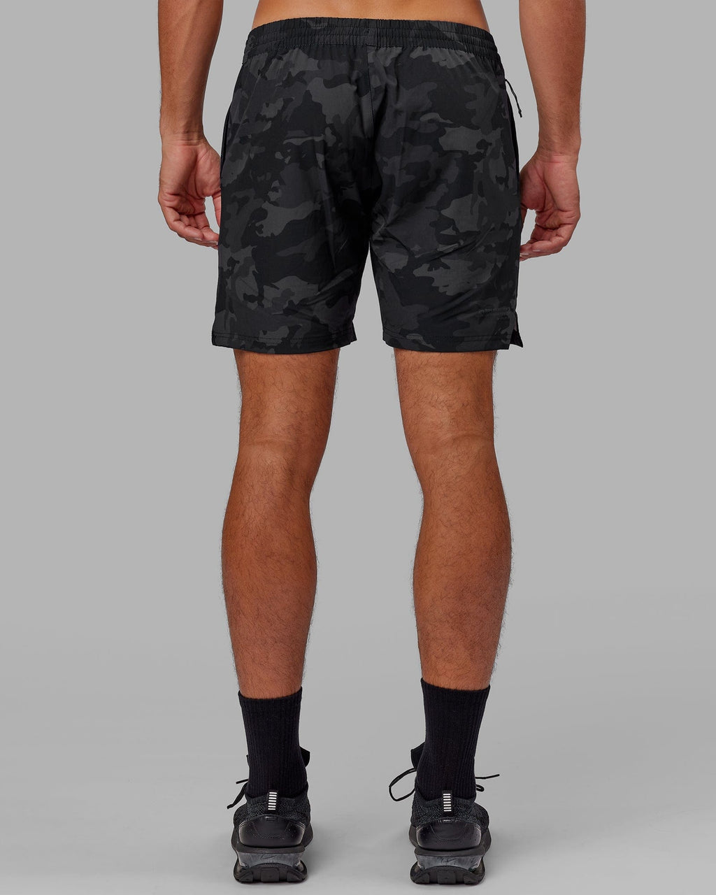 Model wearing Intensity 7" Performance Short - Black-Camo