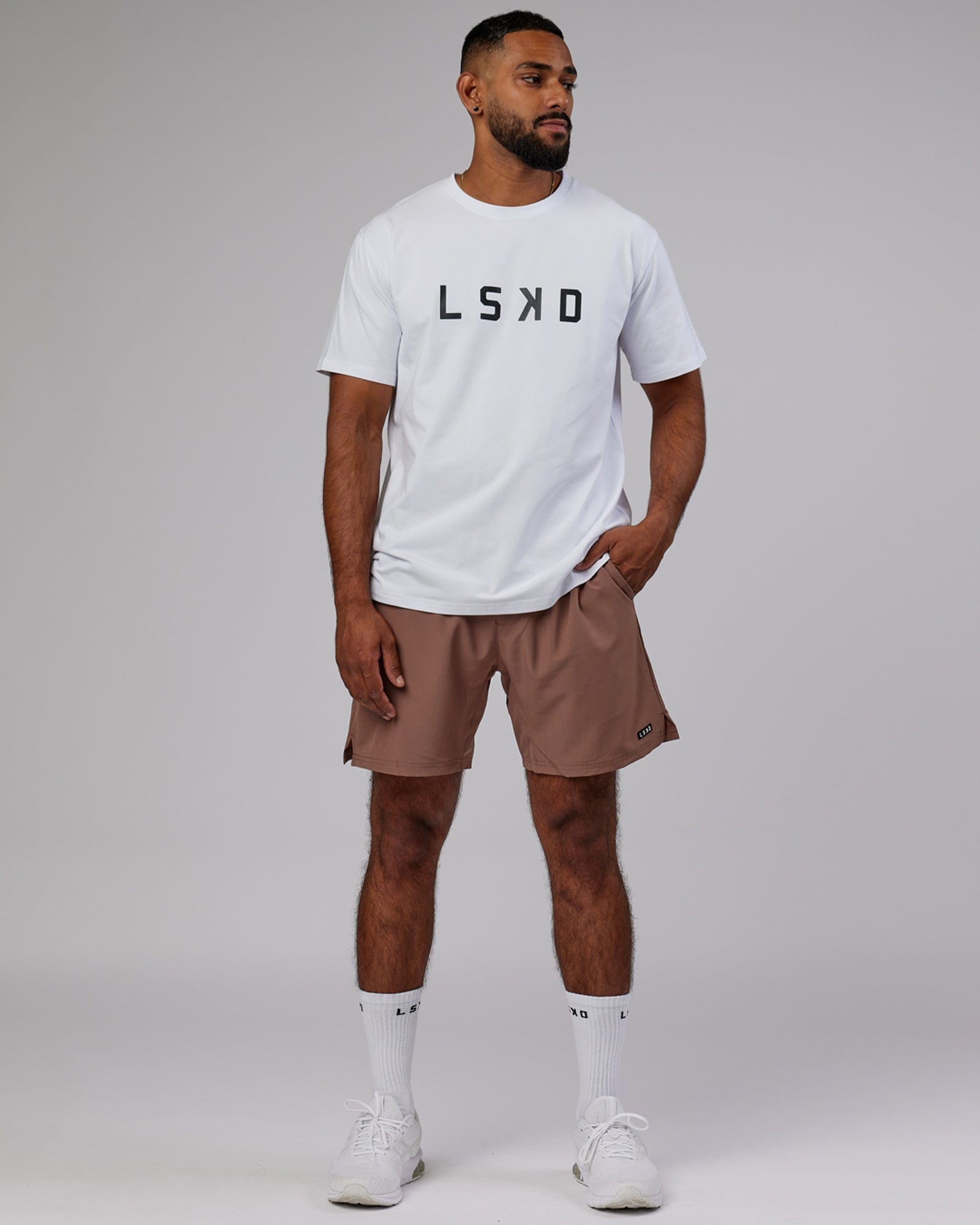 Model wearing Intensity 7'' Performance Short - Deep Taupe