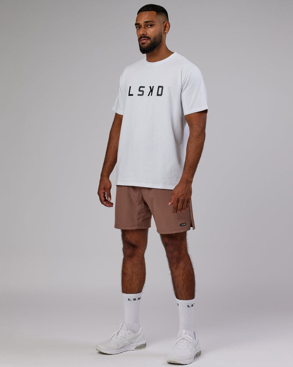 Model wearing Intensity 7'' Performance Short - Deep Taupe