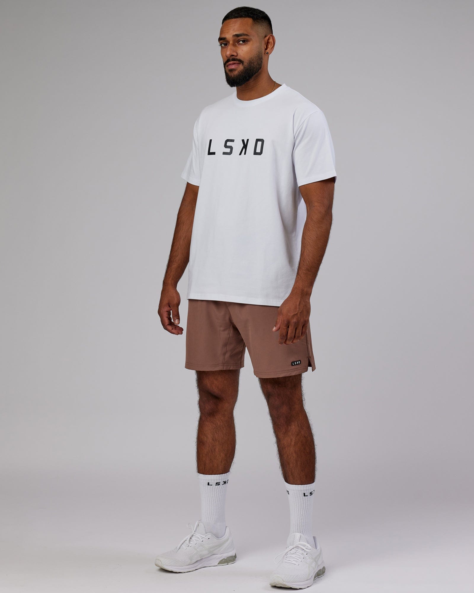 Model wearing Intensity 7'' Performance Short - Deep Taupe