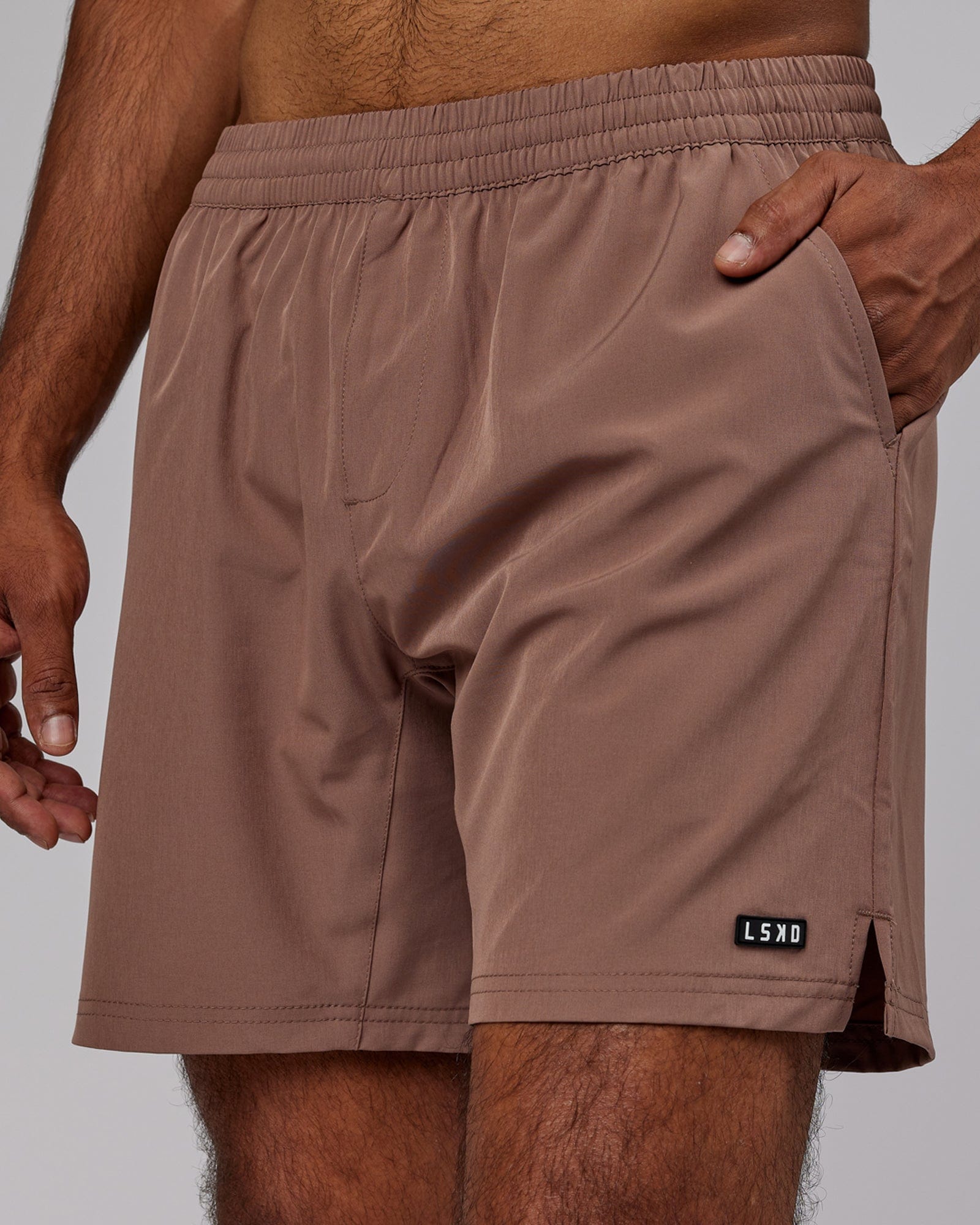 Model wearing Intensity 7'' Performance Short - Deep Taupe