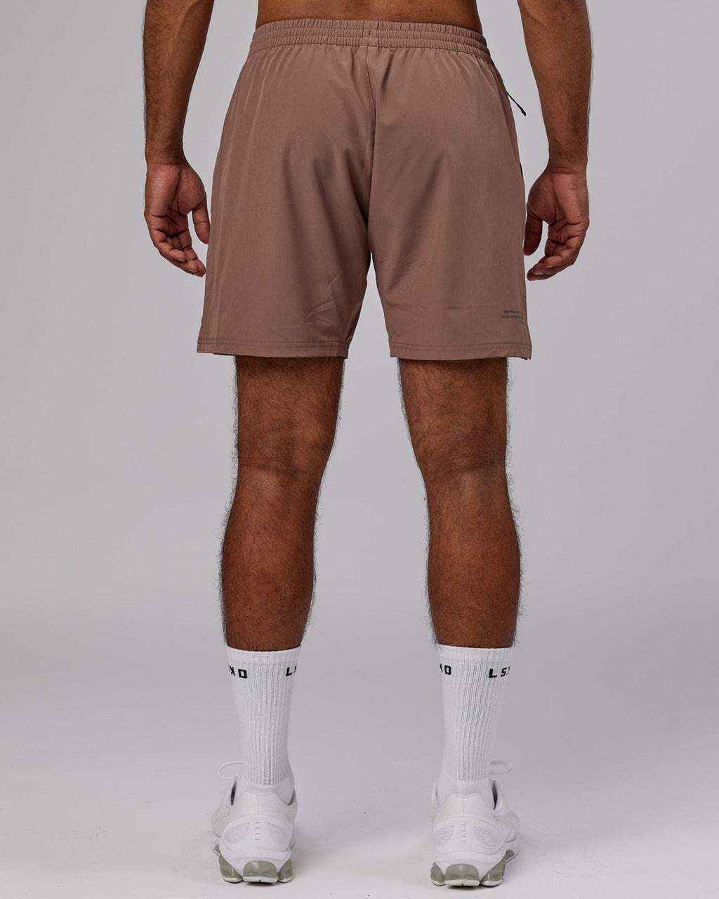 Model wearing Intensity 7'' Performance Short - Deep Taupe