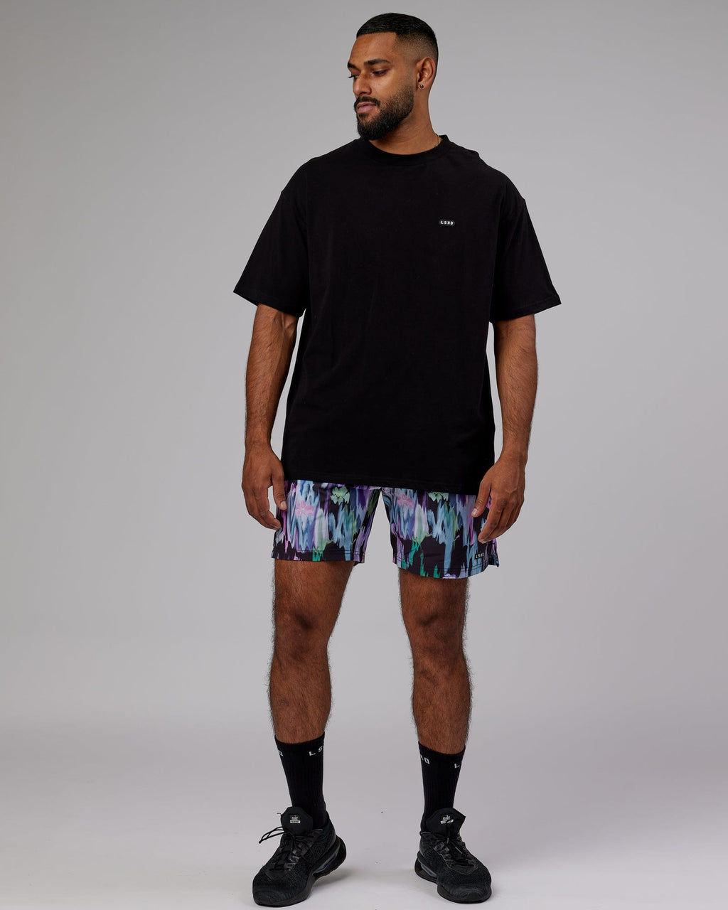 Model wearing Intensity 7'' Performance Short - Hyper Floral Black
