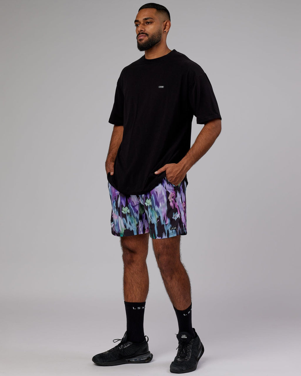 Model wearing Intensity 7'' Performance Short - Hyper Floral Black