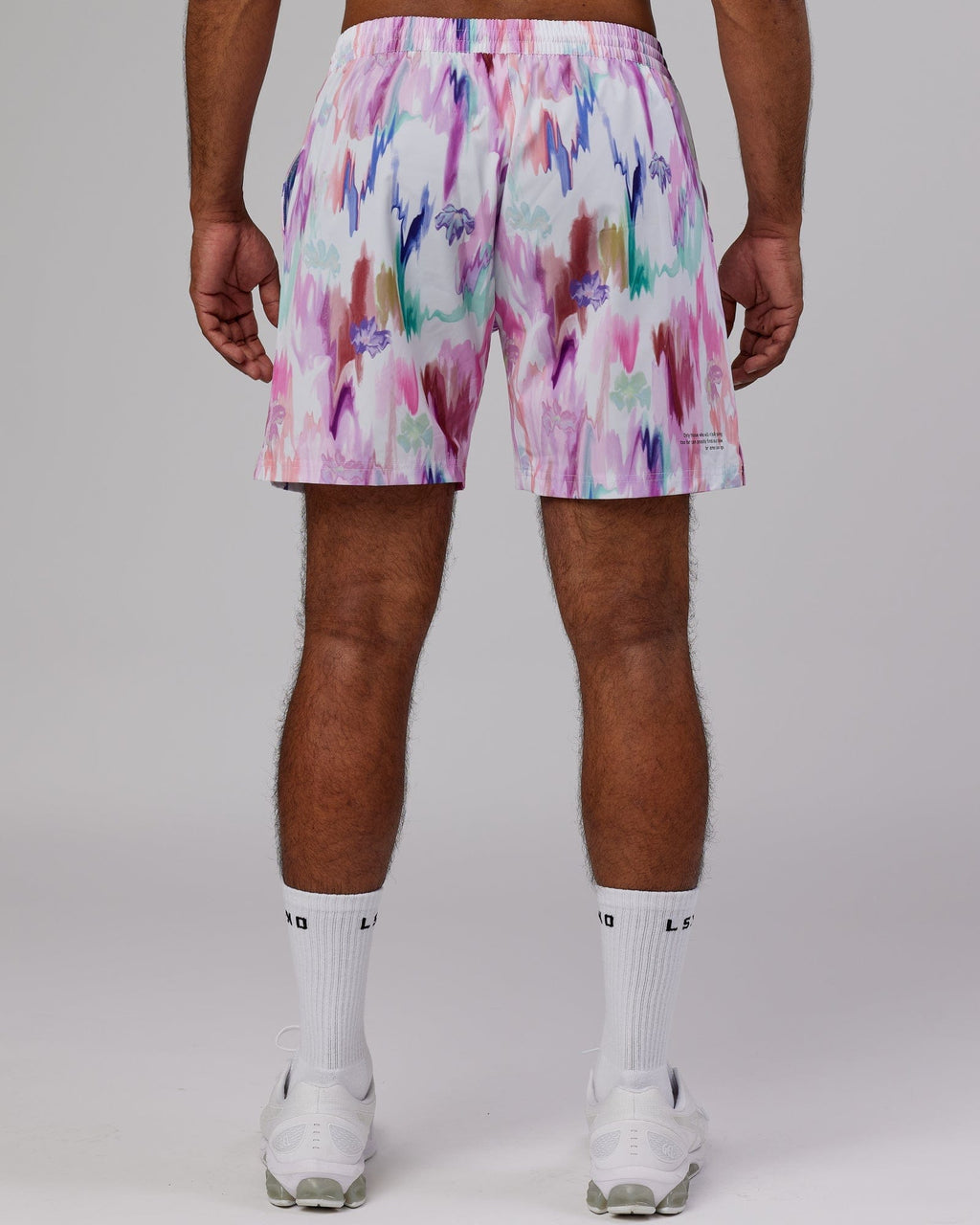 Model wearing Intensity 7'' Performance Short - Hyper Floral White