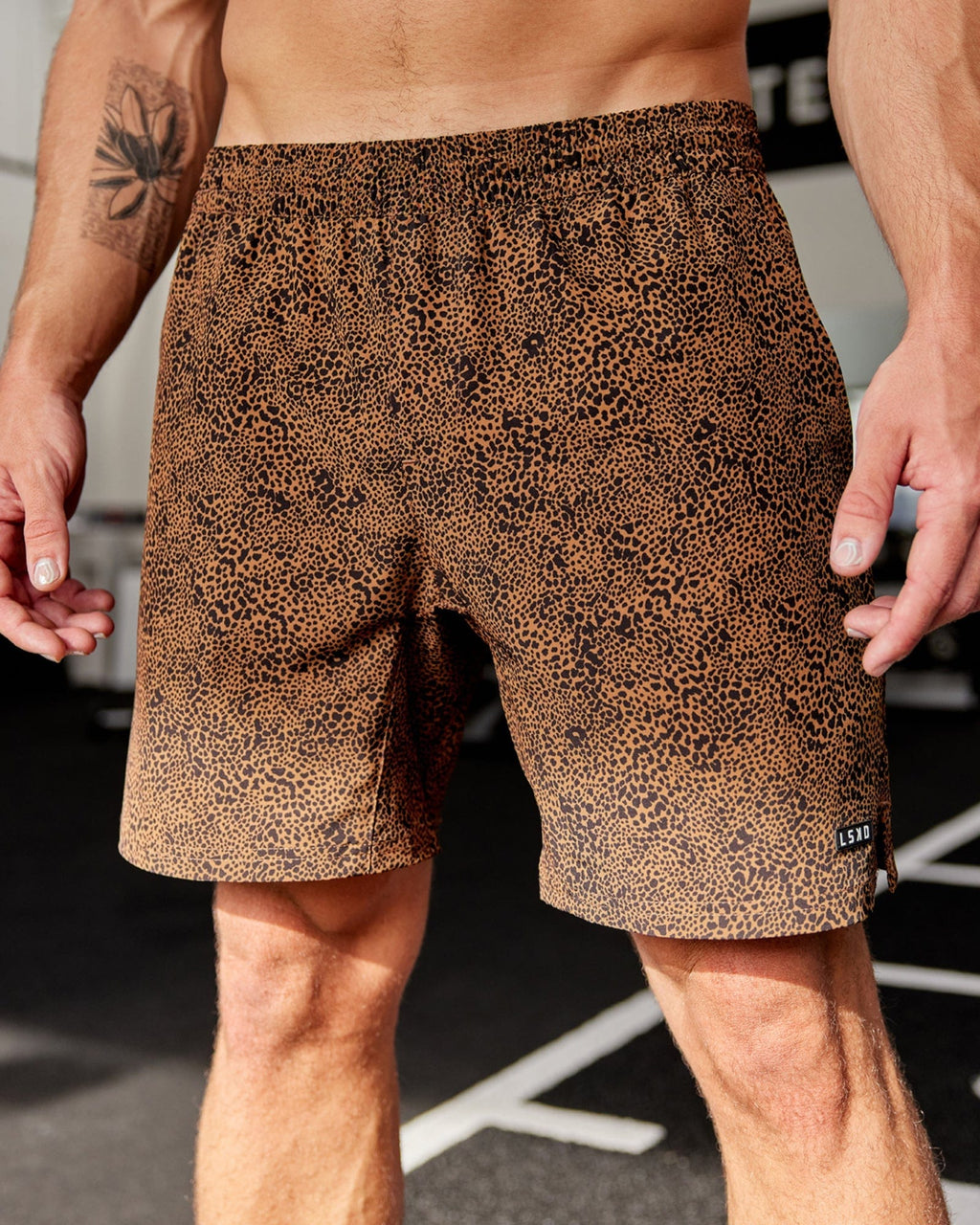 Model wearing Intensity 7" Performance Short - Agile Camel Print