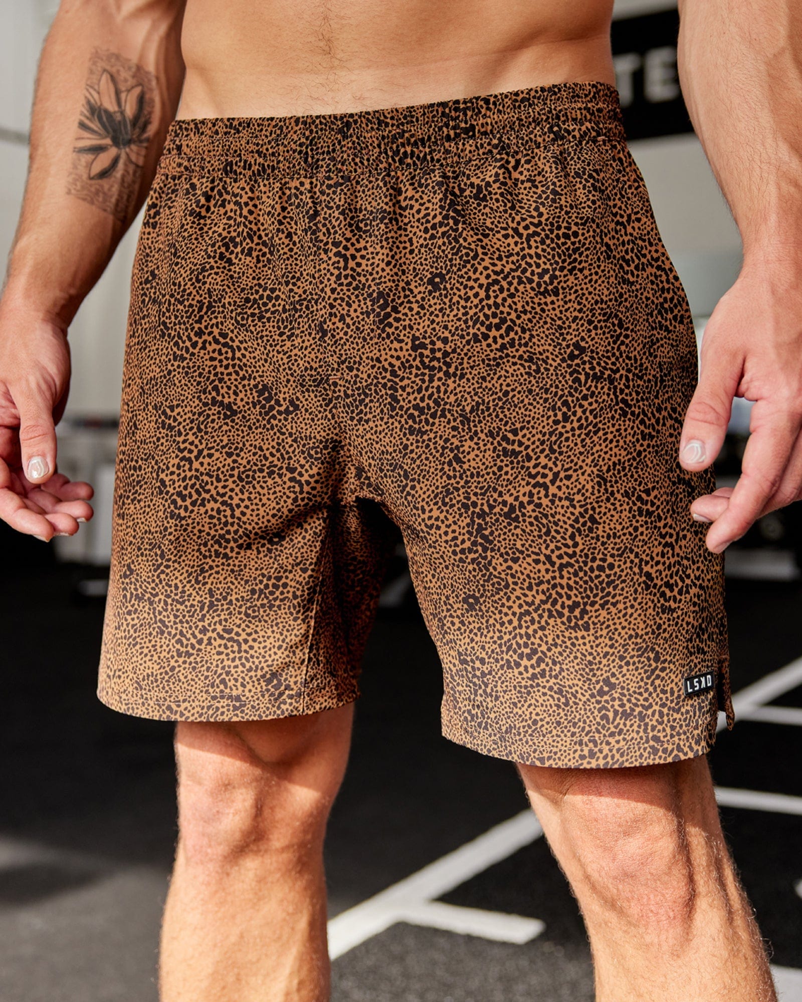 Model wearing Intensity 7" Performance Short - Agile Camel Print