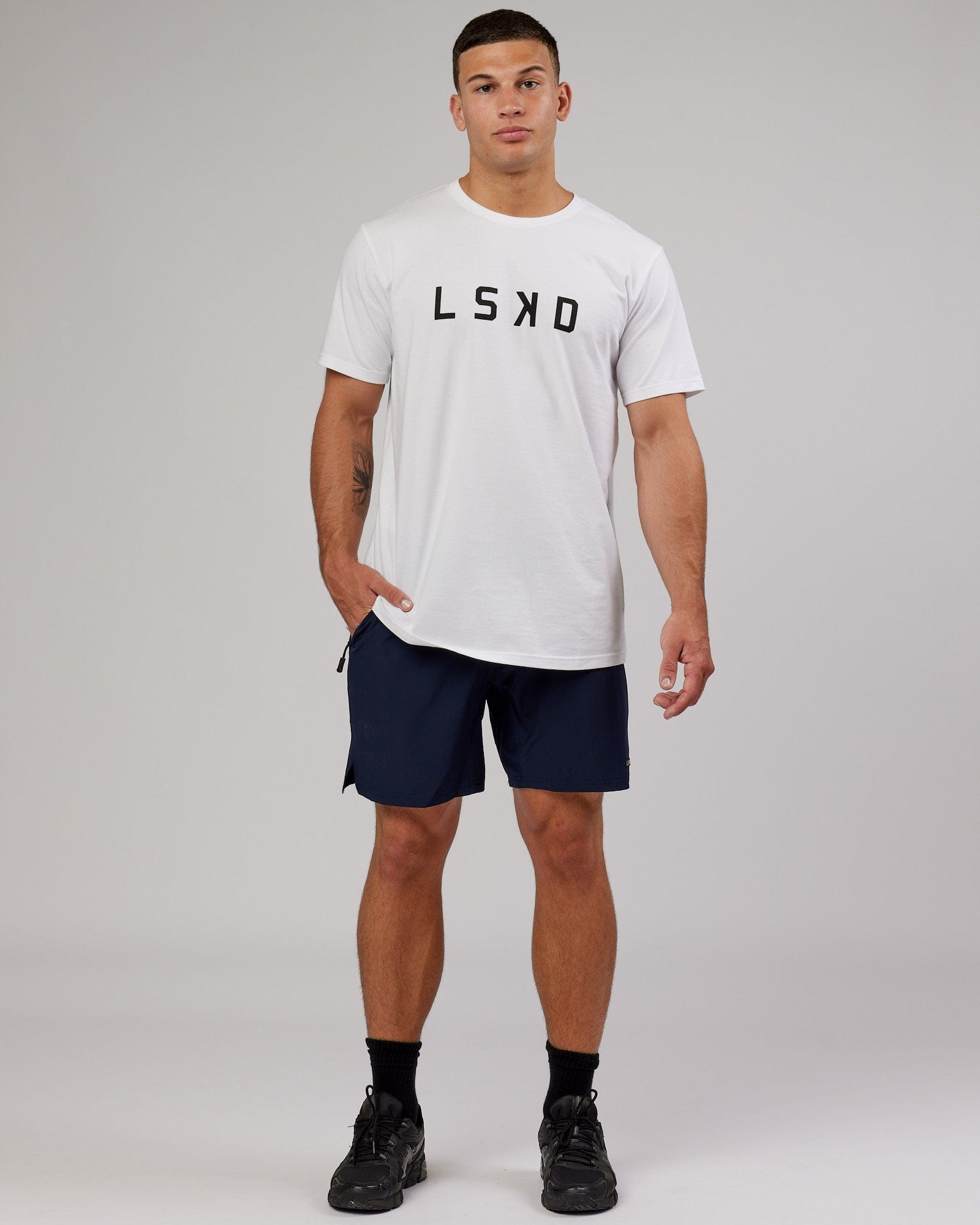 Model wearing Intensity 7'' Performance Short - Navy