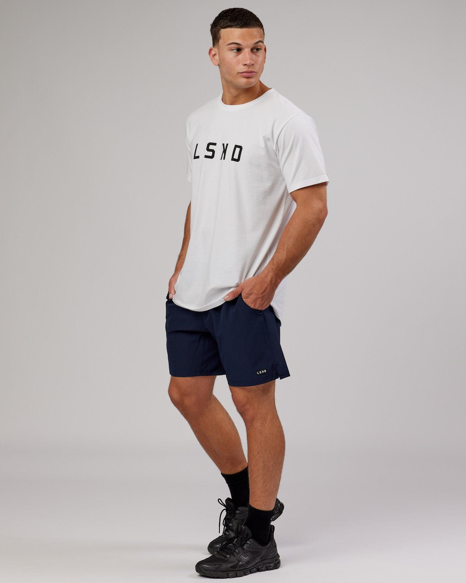 Model wearing Intensity 7'' Performance Short - Navy