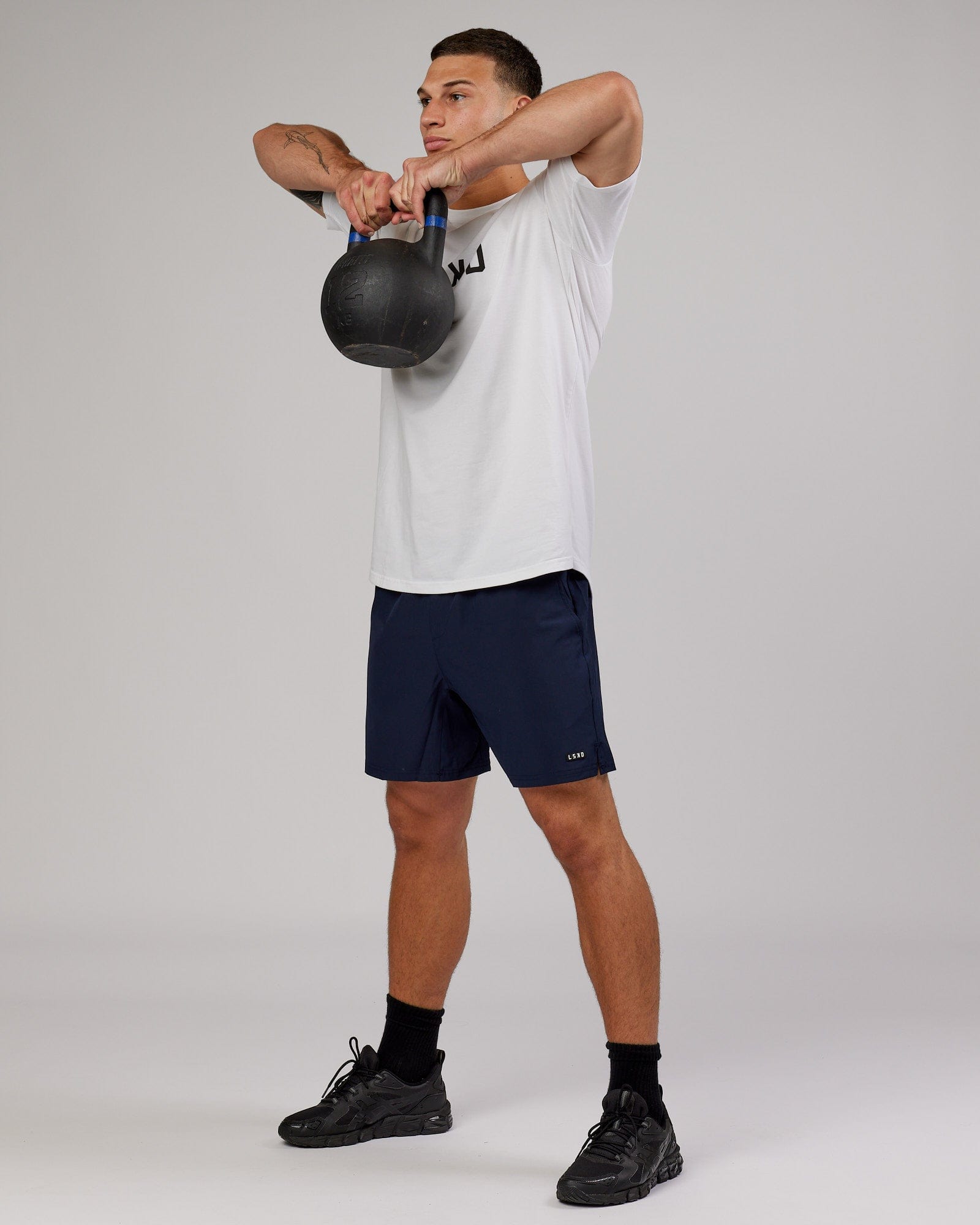 Model wearing Intensity 7'' Performance Short - Navy