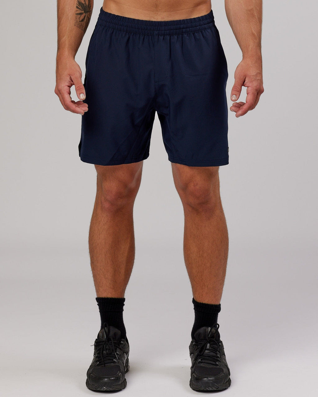 Model wearing Intensity 7'' Performance Short - Navy