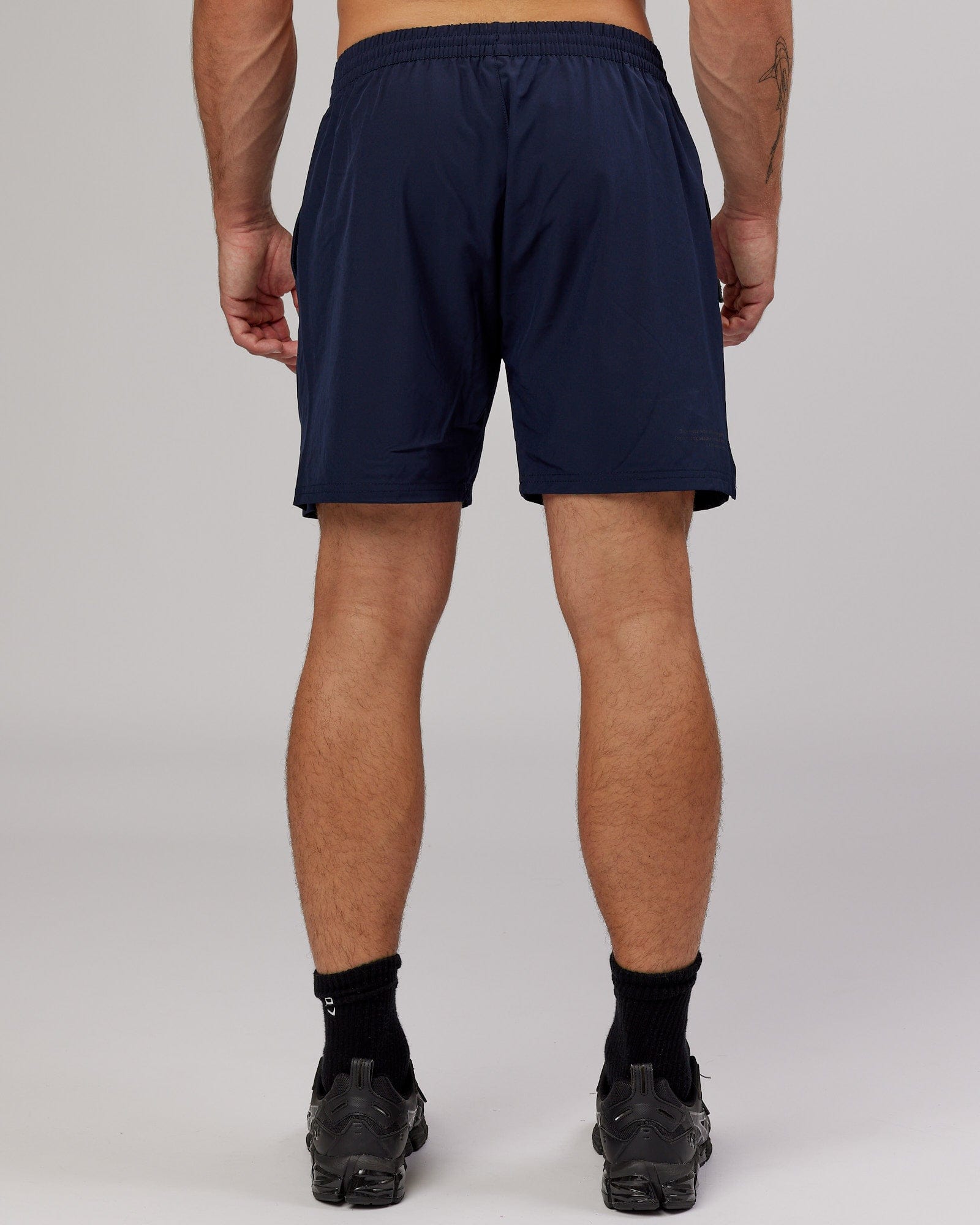 Model wearing Intensity 7'' Performance Short - Navy
