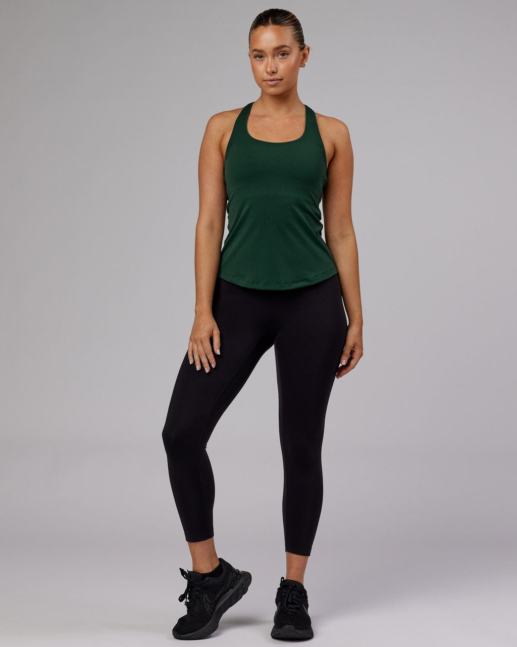 Model wearing Lift Performance Tank - Vital Green
