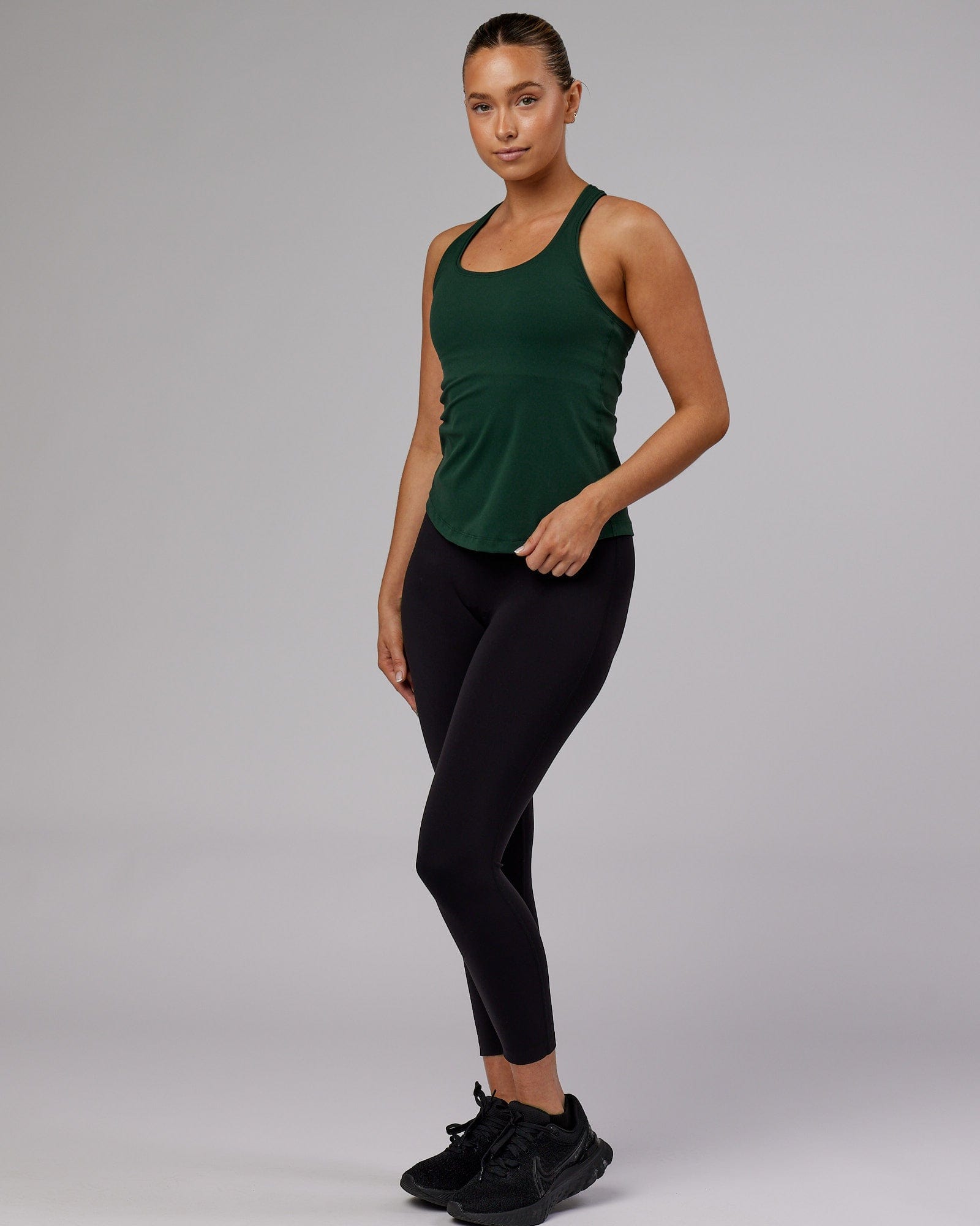Model wearing Lift Performance Tank - Vital Green