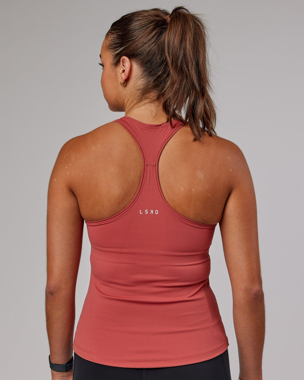 Model wearing Lift Shelf Bra Performance Tank - Marsala