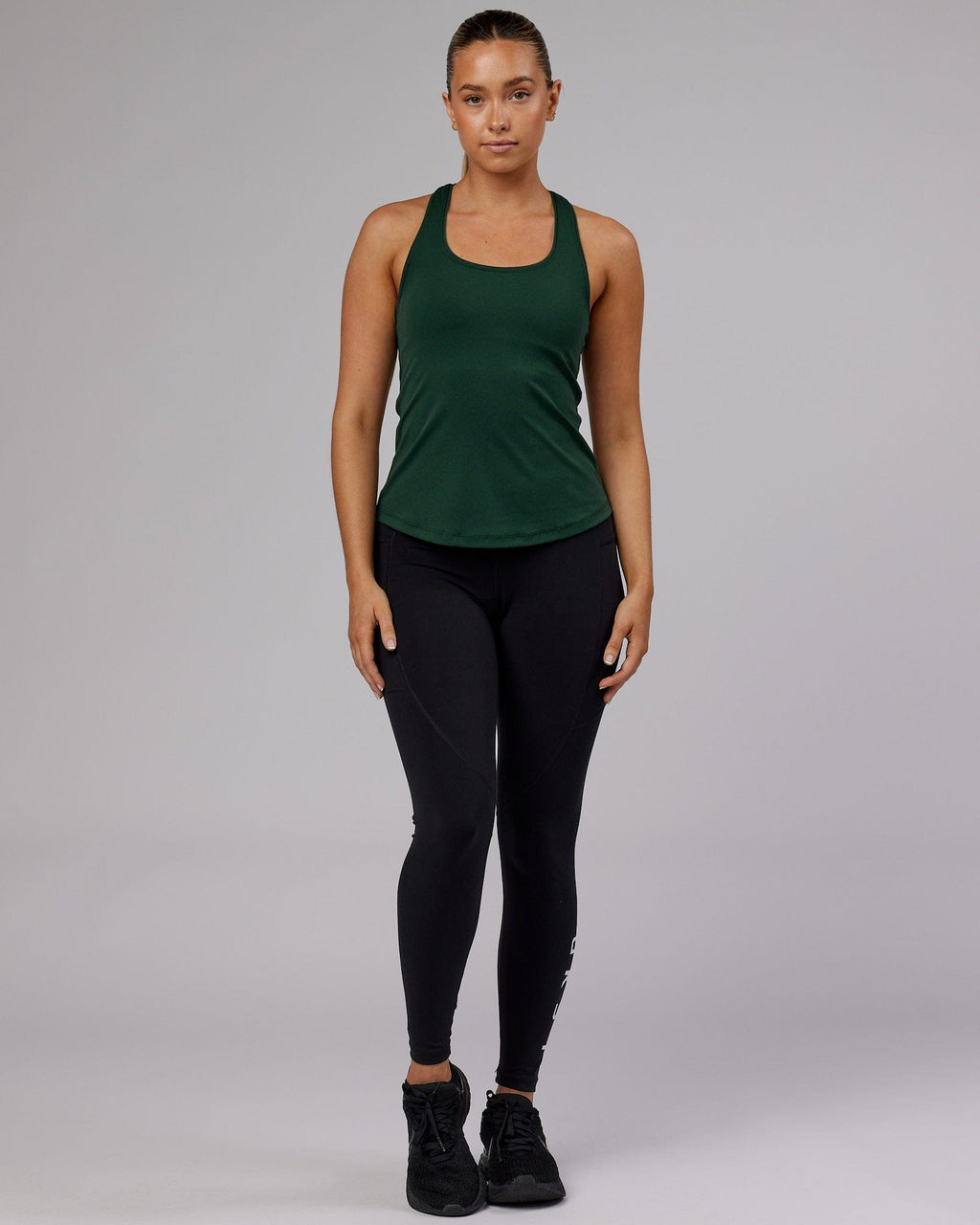 Model wearing Lift Shelf Bra Performance Tank - Vital Green