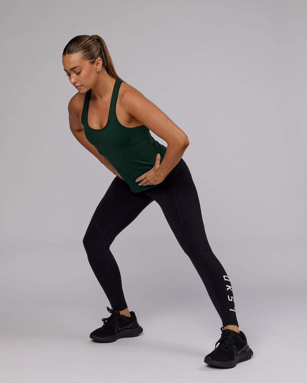 Model wearing Lift Shelf Bra Performance Tank - Vital Green