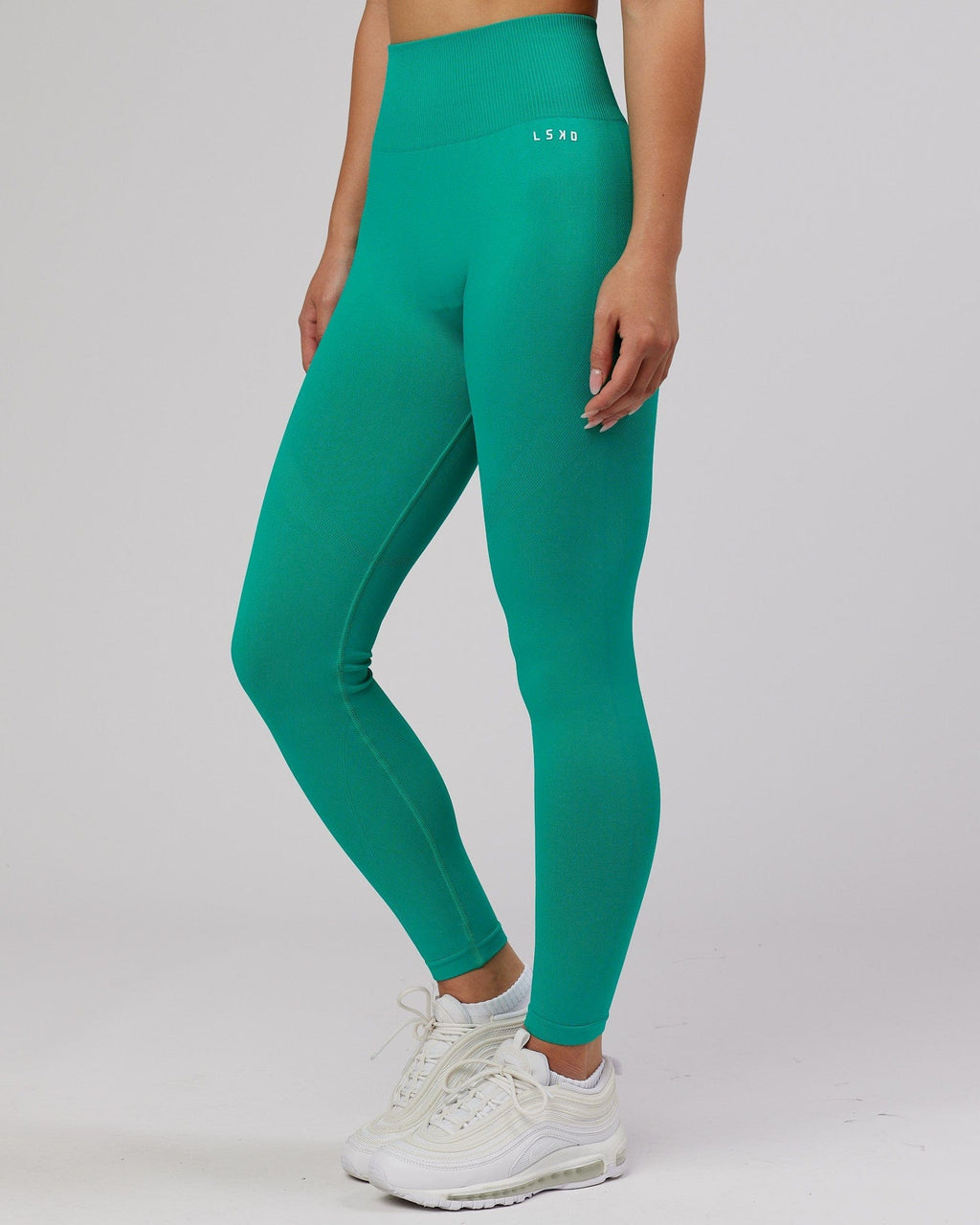 Model wearing Limitless Seamless Full Length Tight - Hyper Teal