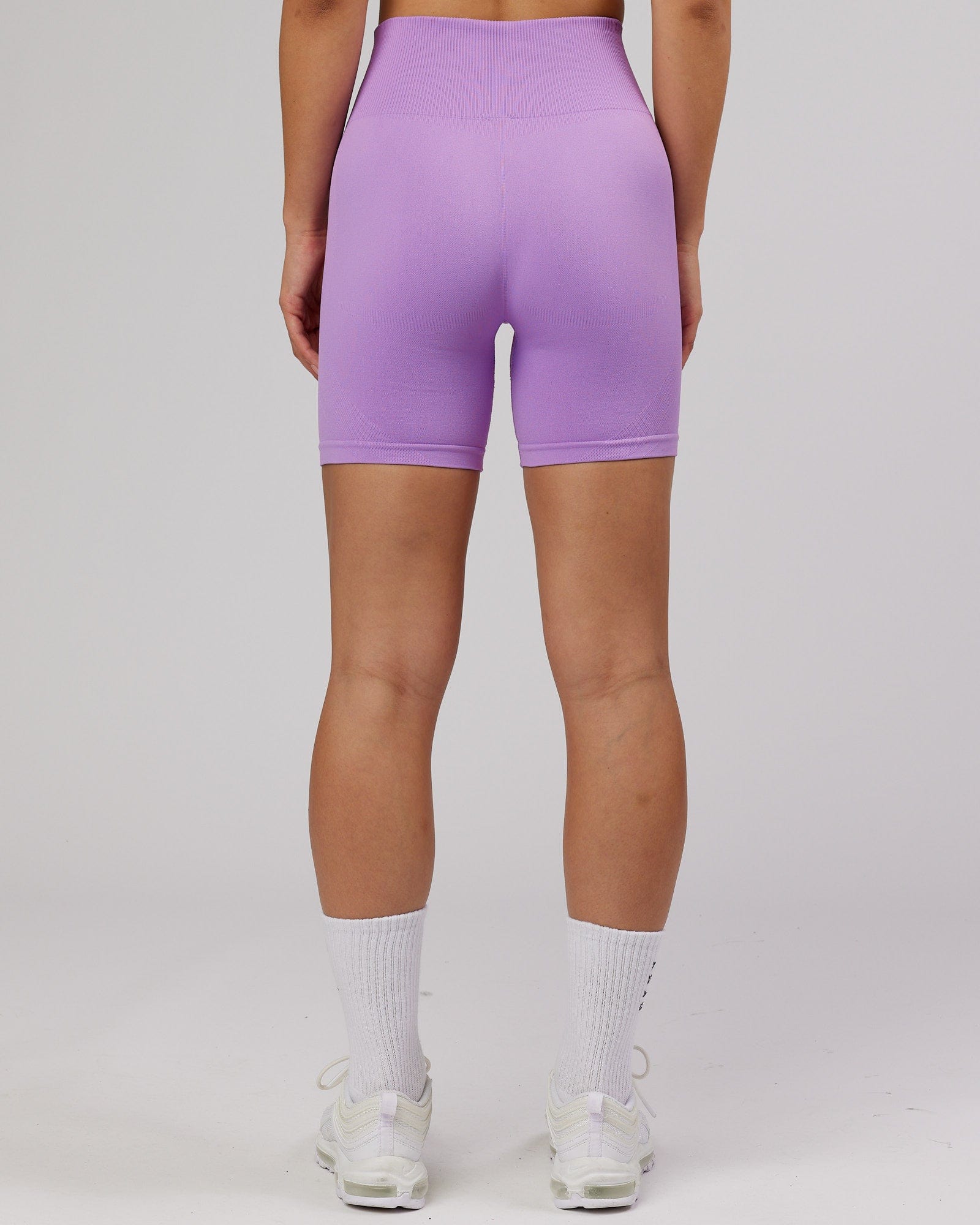 Model wearing Limitless Seamless Mid Short - Lilac