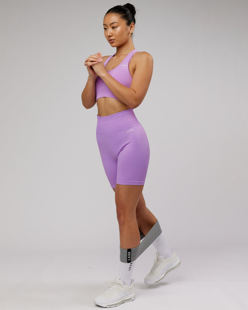 Model wearing Limitless Seamless Mid Short - Lilac