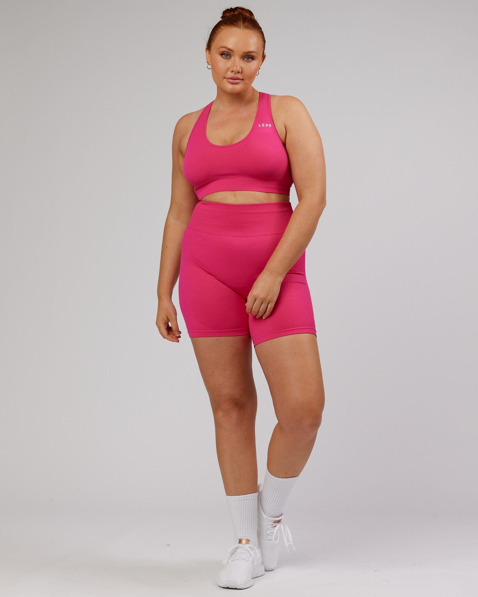 Model wearing Limitless Seamless Mid Short - Magenta