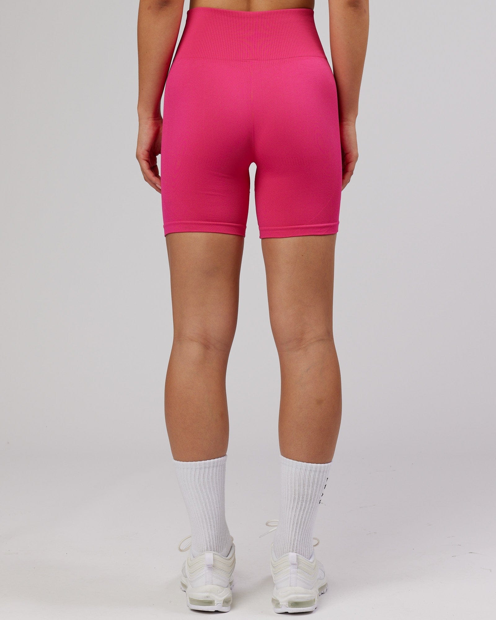 Model wearing Limitless Seamless Mid Short - Magenta