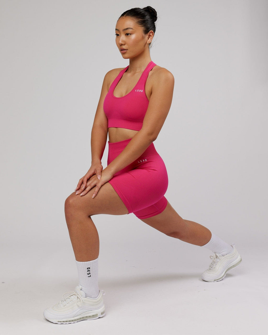 Model wearing Limitless Seamless Mid Short - Magenta