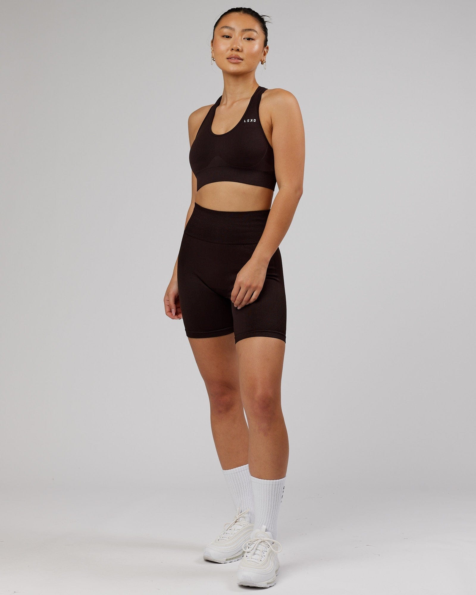 Model wearing Limitless Seamless Sports Bra - Dark Walnut
