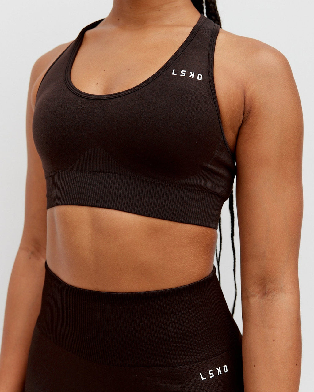 Model wearing Limitless Seamless Sports Bra - Dark Walnut
