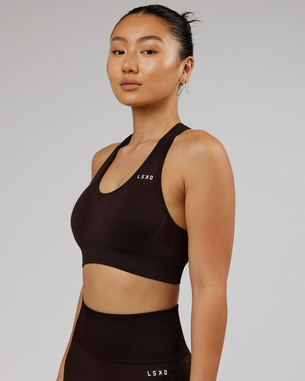 Model wearing Limitless Seamless Sports Bra - Dark Walnut