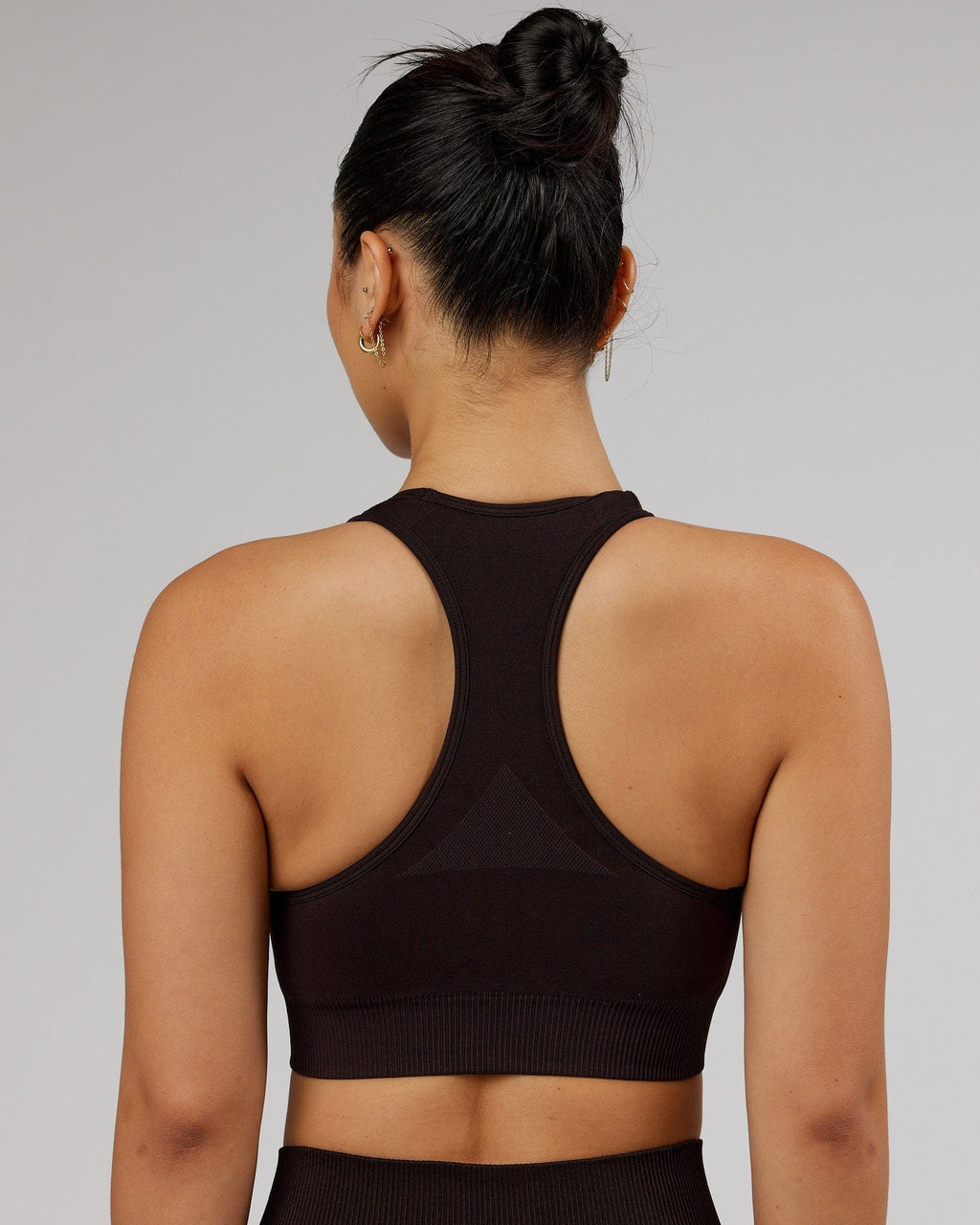 Model wearing Limitless Seamless Sports Bra - Dark Walnut