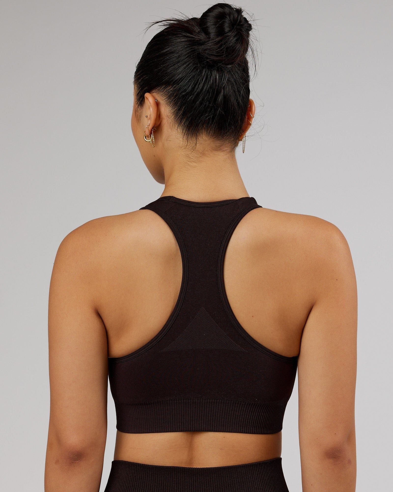 Model wearing Limitless Seamless Sports Bra - Dark Walnut