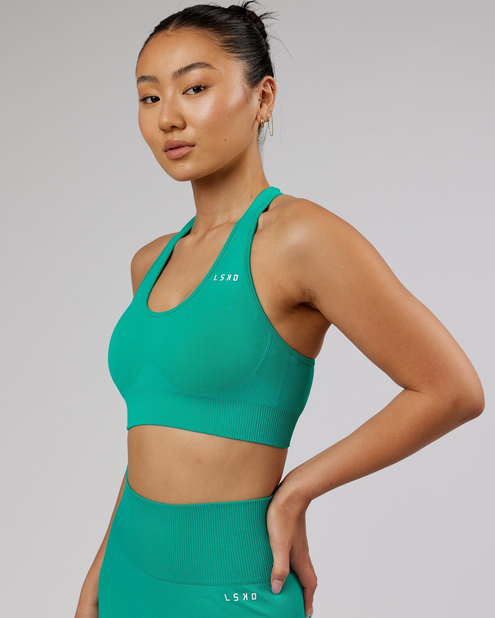 Model wearing Limitless Seamless Sports Bra - Hyper Teal