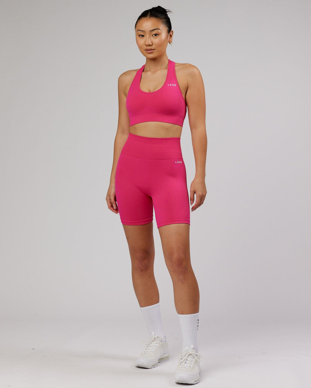 Model wearing Limitless Seamless Sports Bra - Magenta