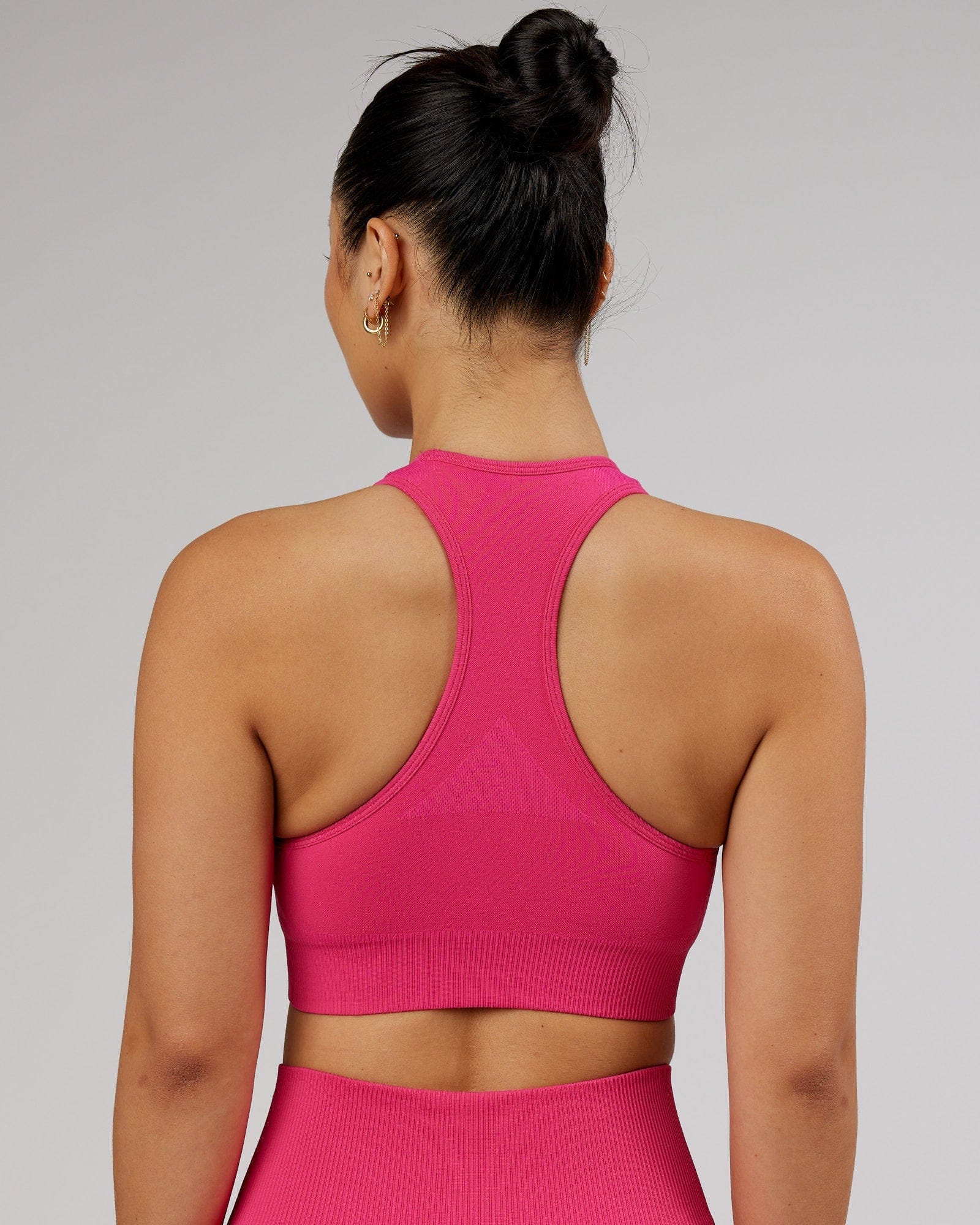 Model wearing Limitless Seamless Sports Bra - Magenta
