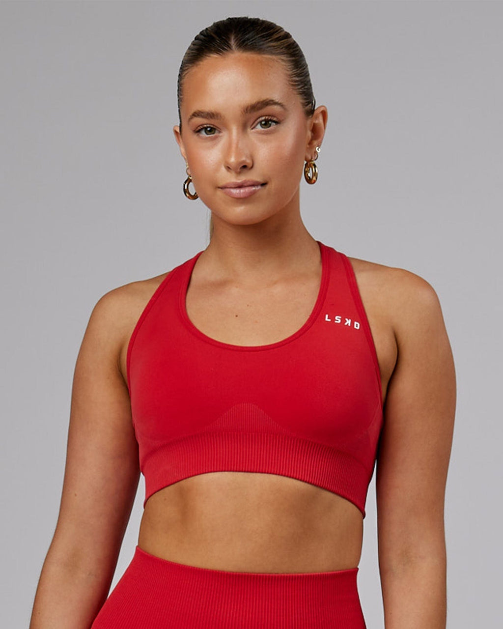 Model wearing Limitless Seamless Sports Bra - Scarlet