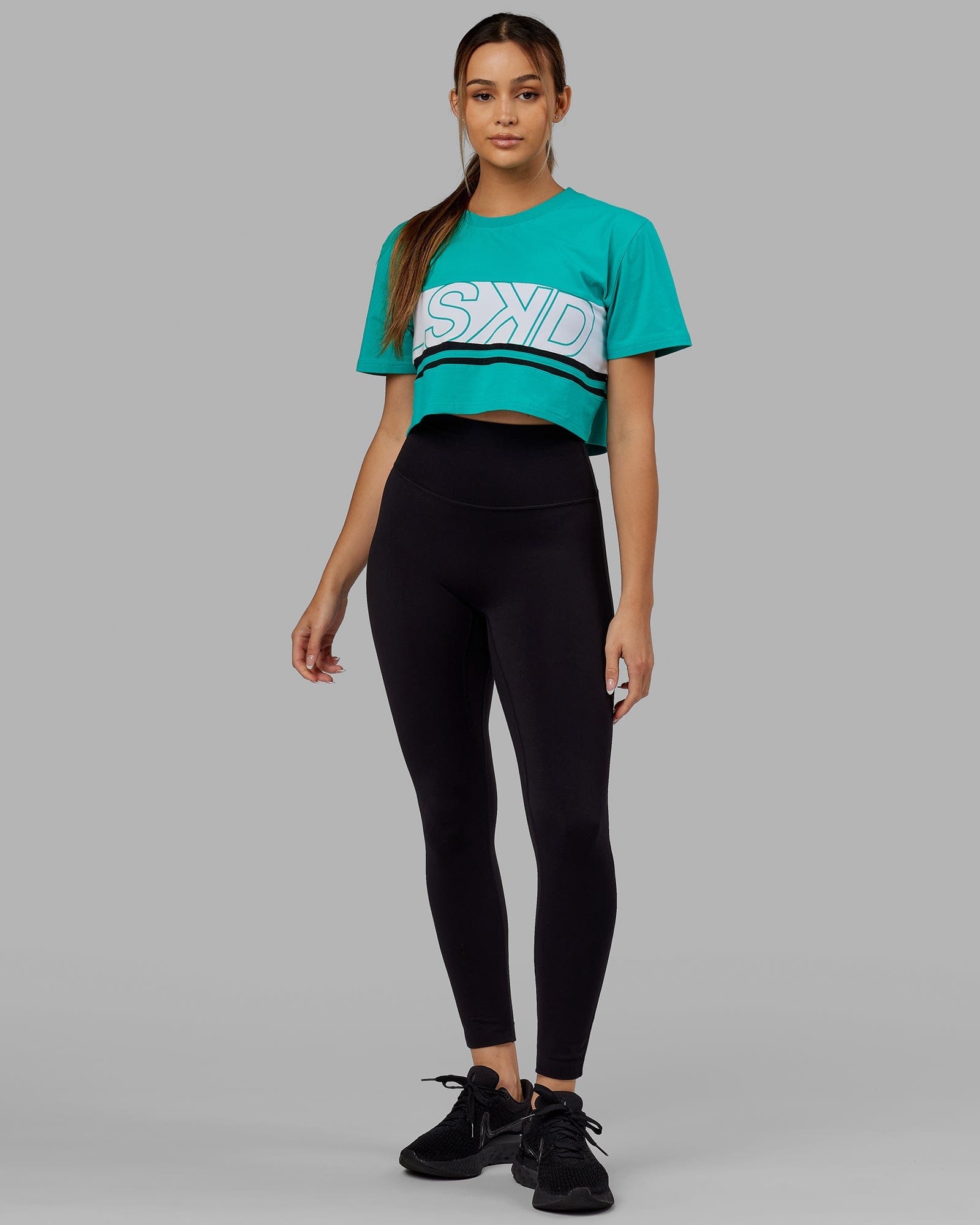 Model wearing Line-Up Cropped Tee - White-Hyper Teal