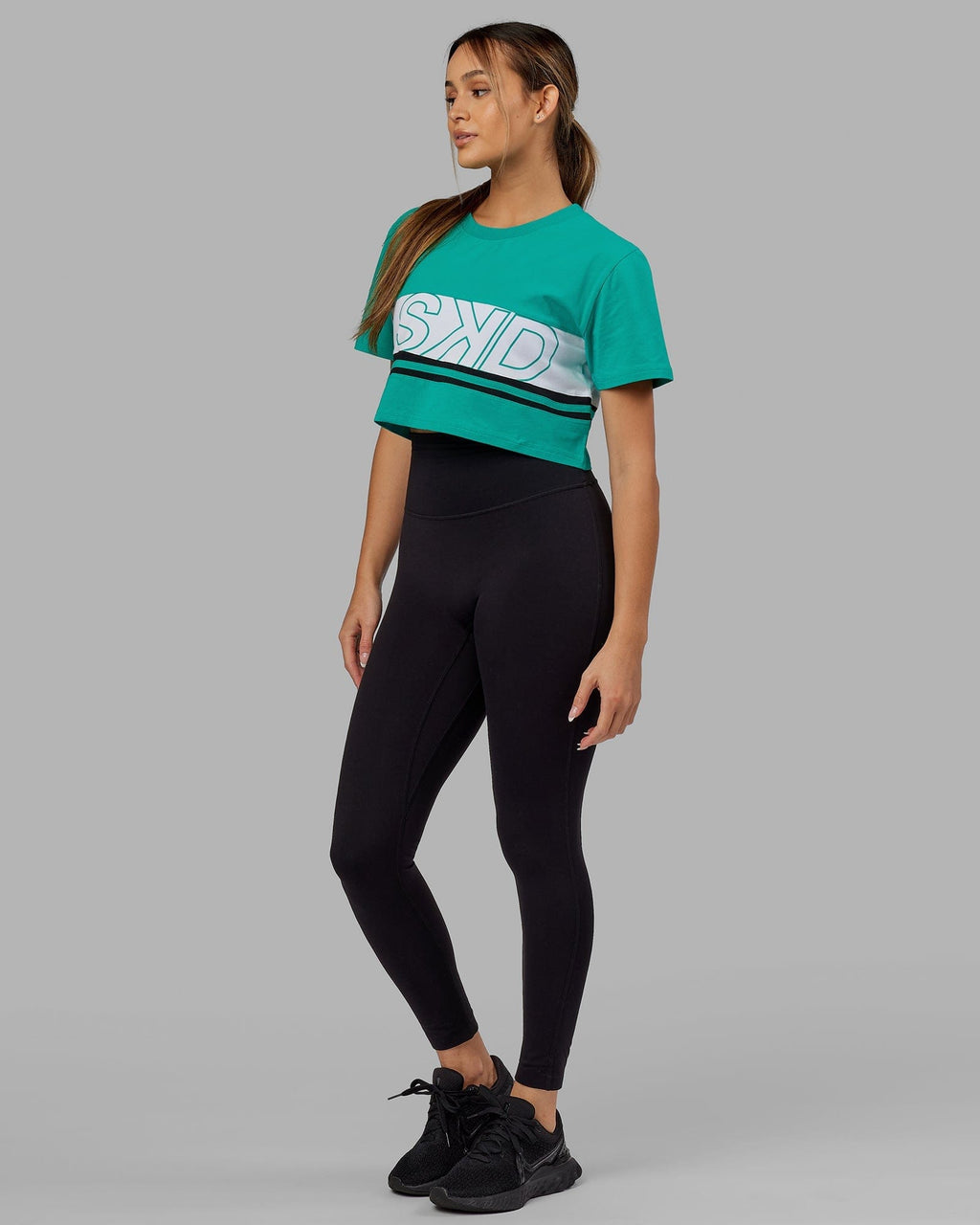 Model wearing Line-Up Cropped Tee - White-Hyper Teal