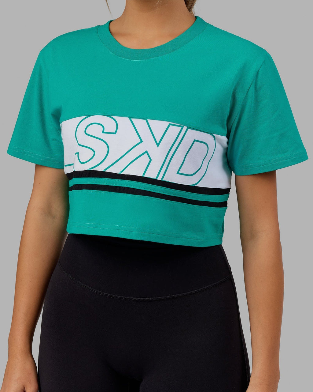 Model wearing Line-Up Cropped Tee - White-Hyper Teal